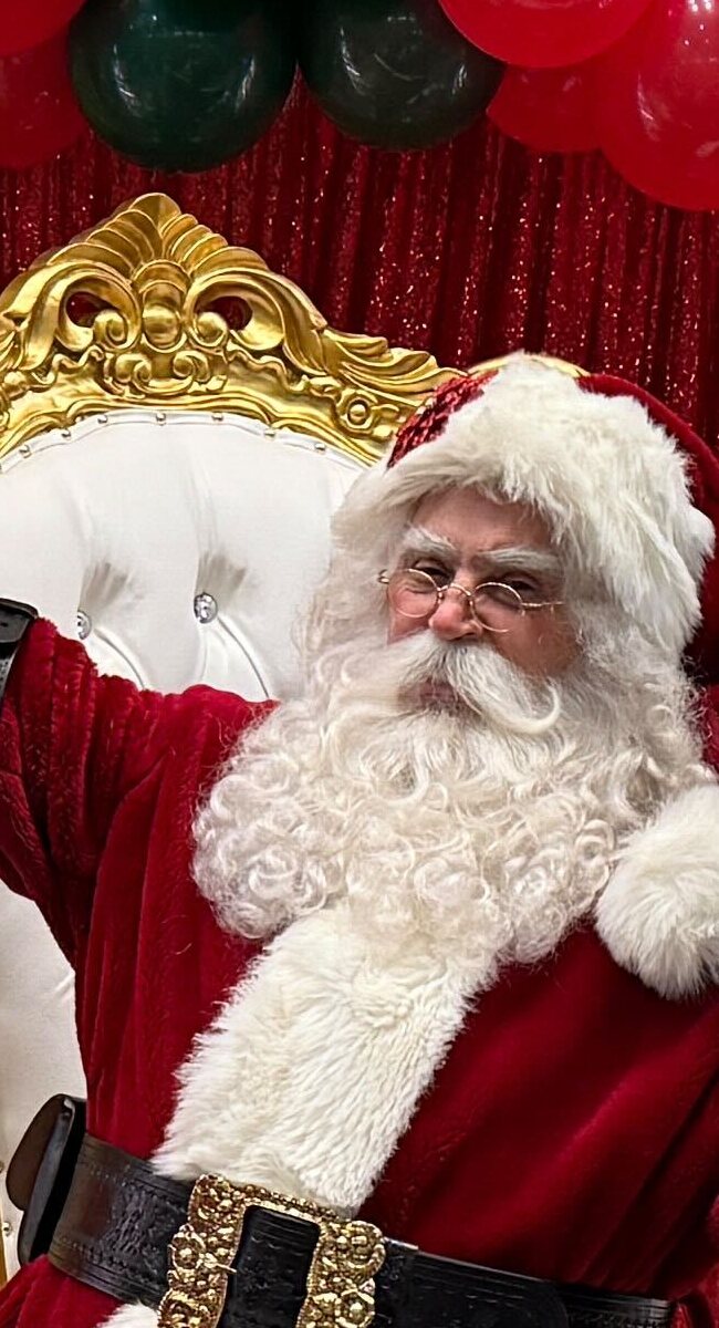 Hire Santa Claus Fort Lauderdale holiday chair portrait