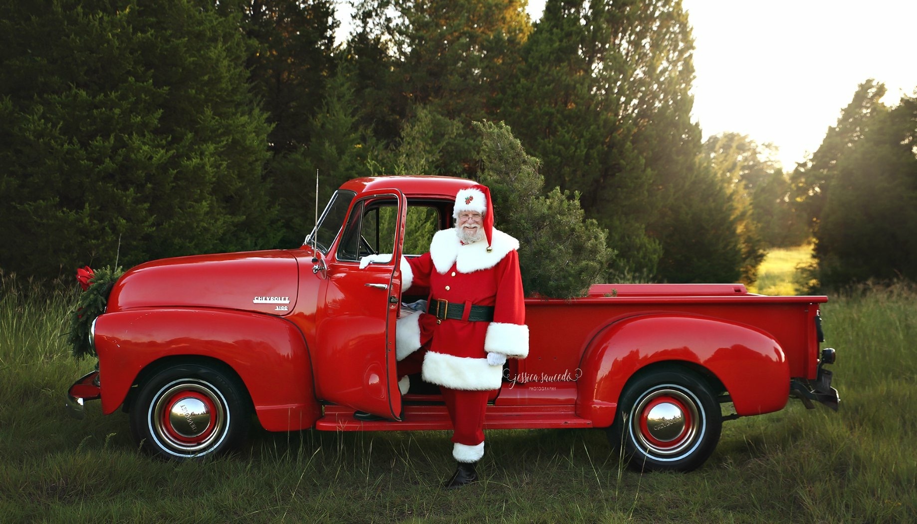 Hire Santa Claus Minneapolis red truck holiday appearance