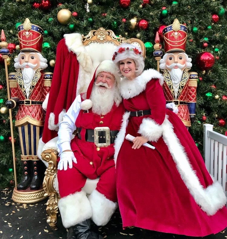 HireSanta Santa Claus talent agency Santa and Mrs. Claus at a holiday event